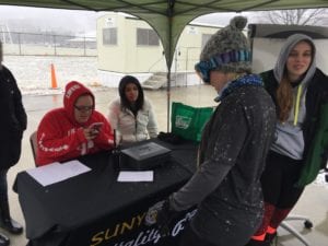 Professor Leigh Morrissey checks in for the Polar Plunge with SUNY Broome Hospitality students.