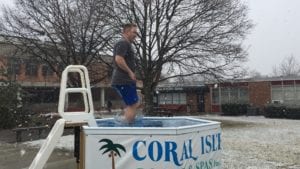The first jumper enters the water at the Polar Plunge