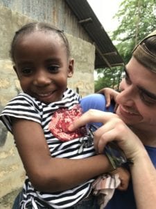 Kevin Carr makes a friend in Haiti. 