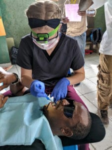 Applying sealants at a Health for Haiti dental clinic