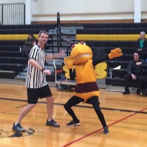 Stinger and Professor Lamoureaux have a dance-off on the court.