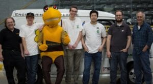 Stinger strikes a pose with the team behind our award-winning Green Van.