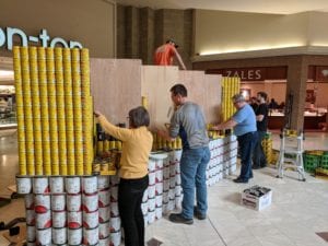Students and faculty construction SUNY Broome's Canstruction entry on April 8.