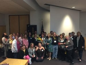 SUNY Broome nursing alumni, faculty and staff gather during the Alumni Reunion for a photo.