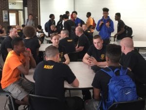 Law enforcement cadets answer students' questions during the Lunch with the Law event.