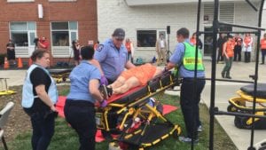Paramedic students transport a patient during the 2018 Mock Environmental Disaster.