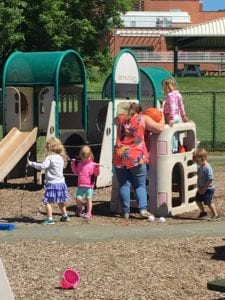 Children play outdoors at BC Center