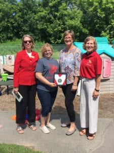 Members of SUNY Broome's Heart Walk committee with BC Center Pam Holland and the college's award for participation in the Heart Walk.