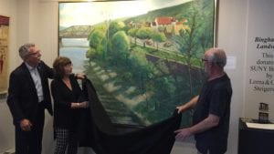 SUNY Broome Executive Vice President and Chief Academic Officer Francis Battisti and alumni Lorna and Conrad Steigenwald unveil a Michael Tanzer painting that the couple donated to the college.