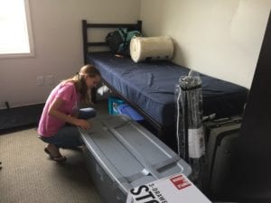 A student from Tioga County unpacks during Move-In Day