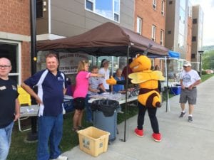 Stinger greets members of Central Baptist Church, which provided free food on Move-In Day.