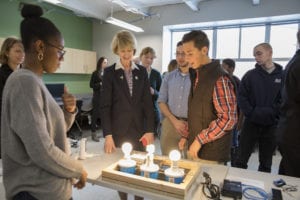 Engineering Science students demonstrate an experiment showing the energy efficiency of light bulbs to SUNY Chancellor Kristina Johnson.