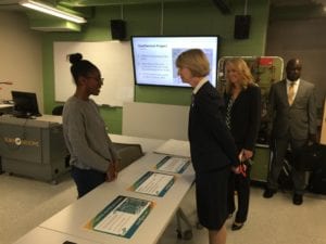 SUNY Chancellor Kristina Johnson speaks with SUNY Broome Engineering Science students in the Calice Center's green energy classroom, the Sustainability Sandbox, on Oct. 17, 2018.