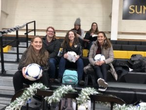 The women's soccer team during the 2018 Giving of the Toys