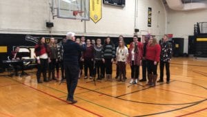 The SUNY Broome Choir performs during the 2018 Giving of the Toys