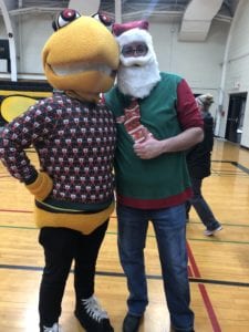 Stinger strikes a pose with Dean of Students Scott Schuhert in a holiday disguise