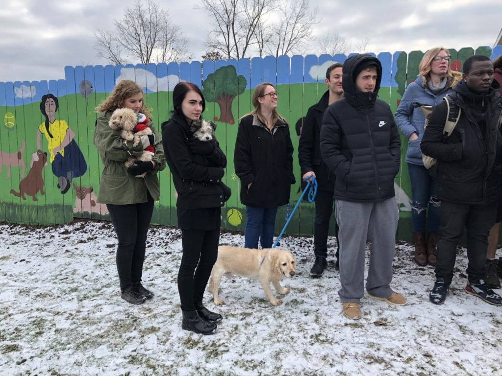 SUNY Broome students hold dogs during a press conference at the Broome County Dog Shelter.