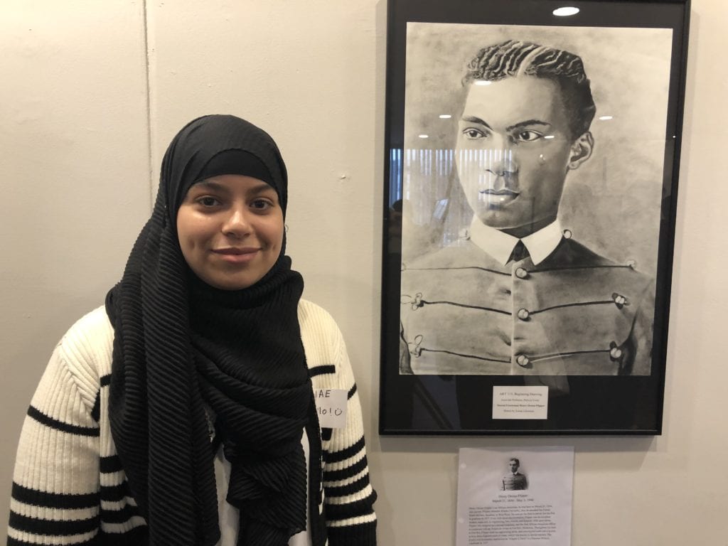 Asmae Lhamrani and her completed portrait
