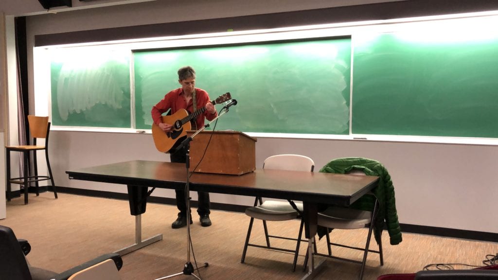 Eliot Fiks performs a song during an April 23 discussion of Kristallnacht.