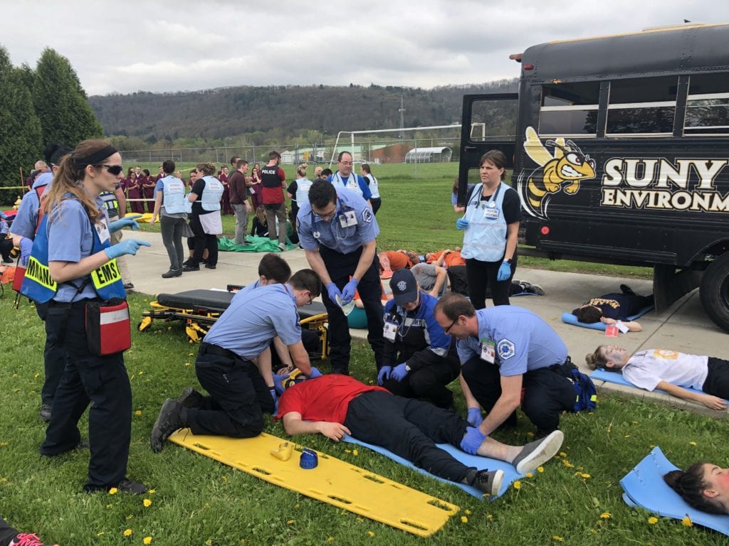 Paramedics treat a patient at the Mock Disaster