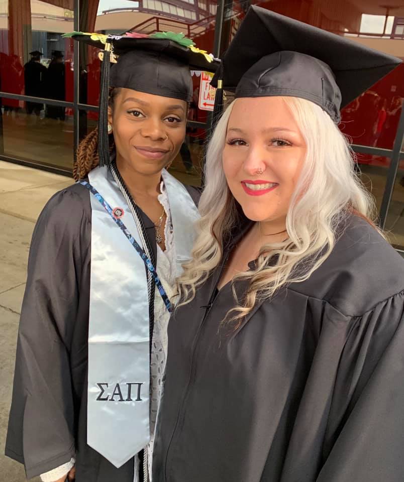Music therapy major Dhane Redmond of Brooklyn and McKayla Vandermark, a human services major from Endicott in line for the 2019 SUNY Broome commencement ceremony Thursday night.