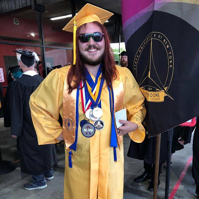 With math equations on his sleeves and a slew of medals, Orion Barber wore his commencement best.