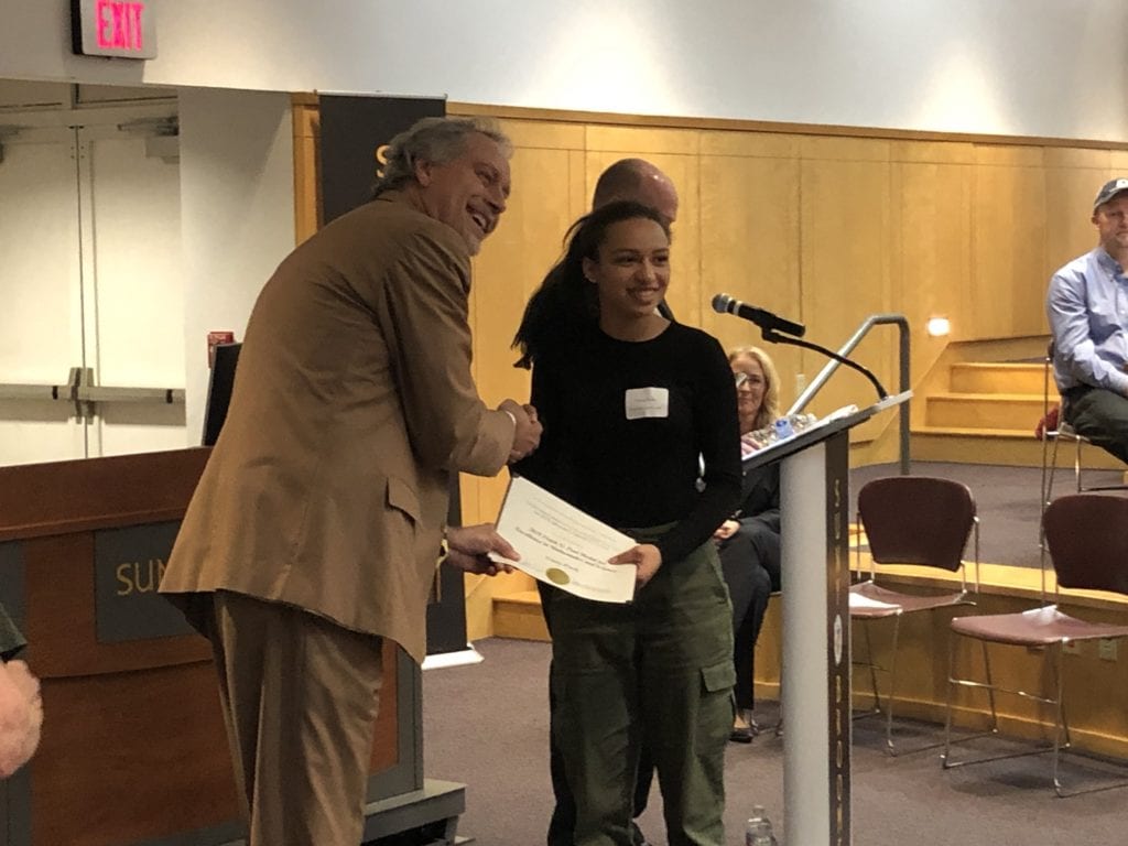 Trinity Purdy receives the Frank G. Paul award from SUNY Broome President Kevin E. Drumm