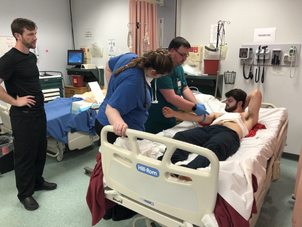 Nursing students treat a patient during the Mock Disaster