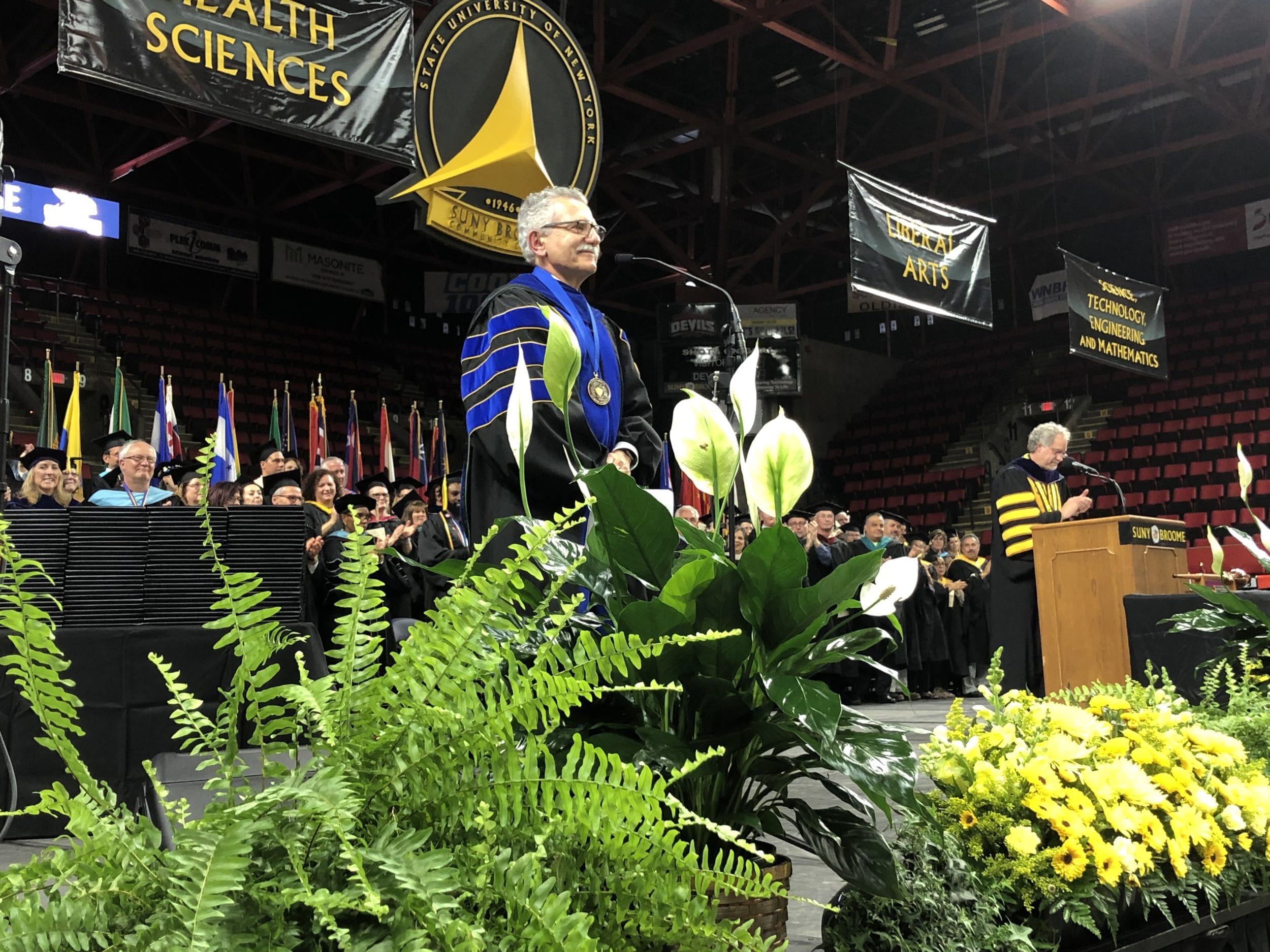 Executive Vice President and Chief Academic Officer Francis Battisti stands for applause during Commencement 2019.