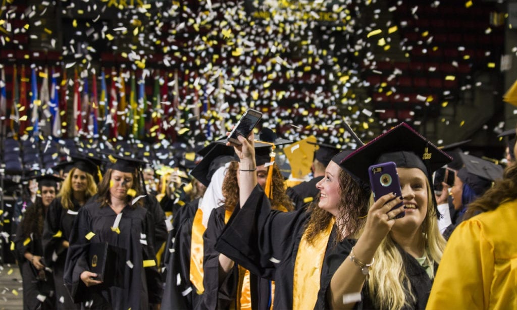 Confetti rains down during the 2018 commencement ceremony