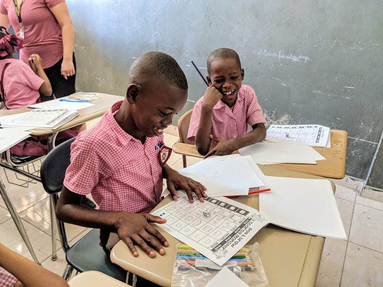 Young students at a desk in Haiti
