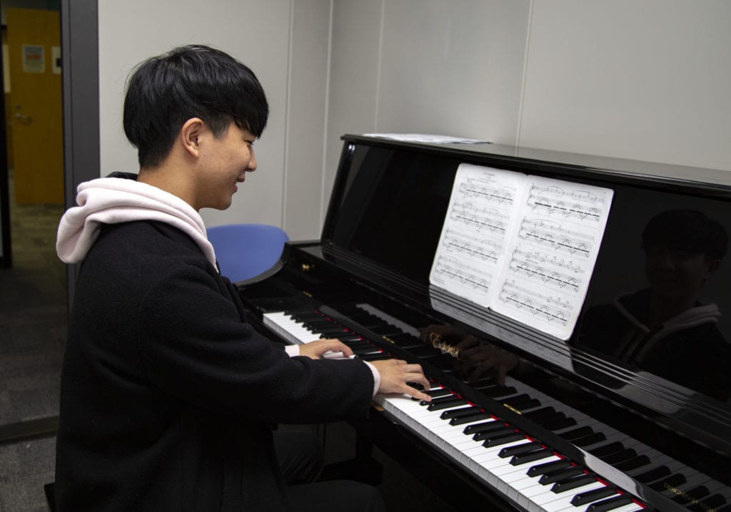 Harry Jang plays the piano.