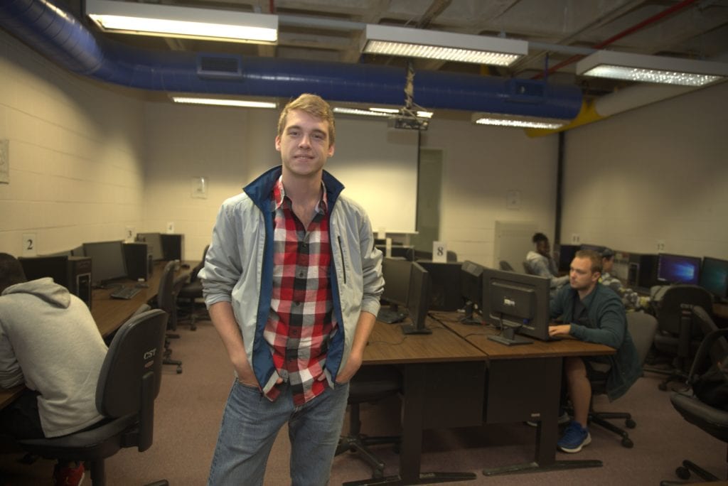 Christopher Painter in the Computer Lab where he tutors his peers