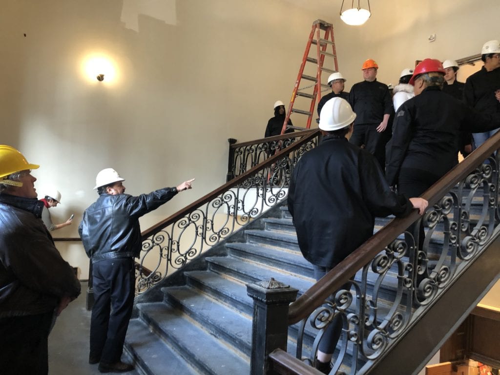 Professor Rey Wojdat points out the finer details of the Culinary & Event Center staircase