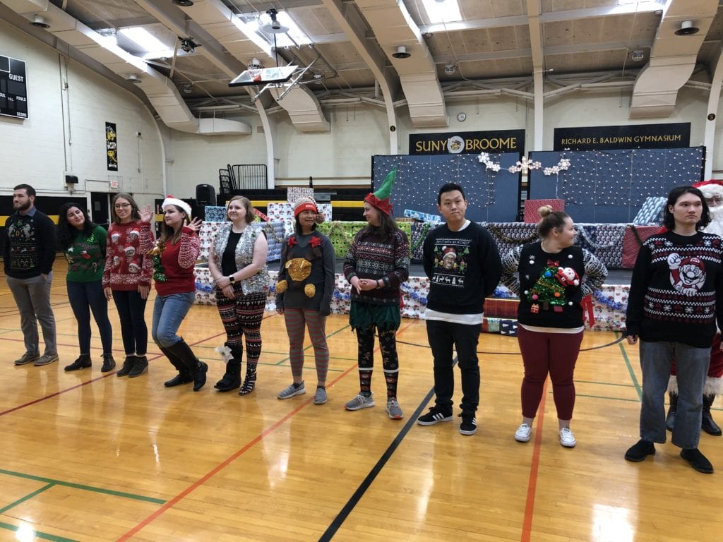 The ugly sweater contest contestants during the Giving of the Toys on Dec. 5, 2019