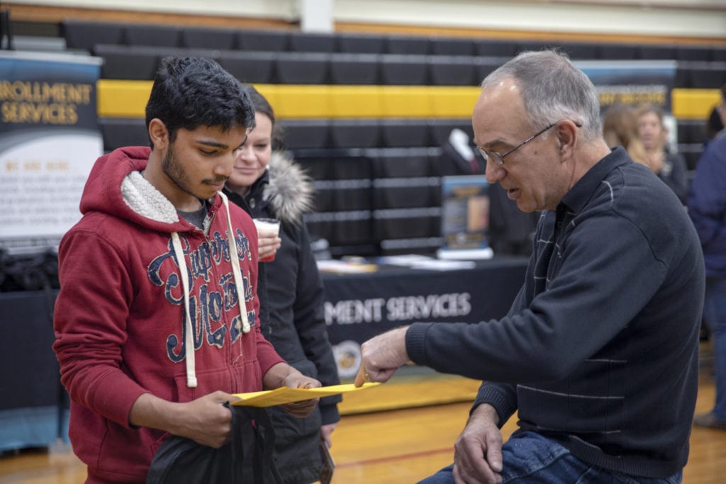 Professor DeAngelo talks with a prospective student during Open House 2019