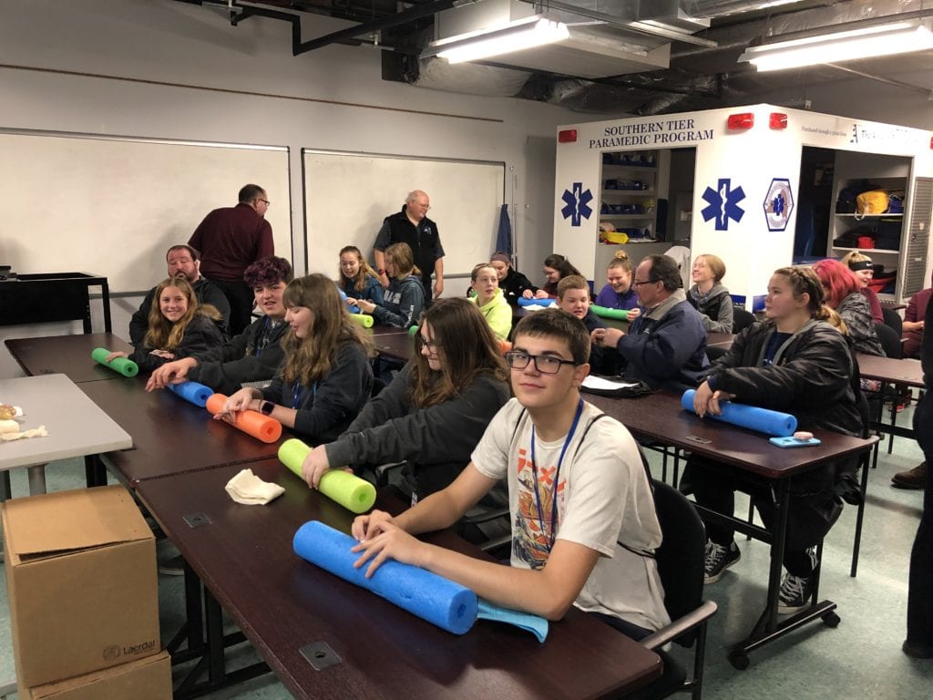 Students learn how to staunch a bleeding wound during SPARK on Jan. 22, 2020