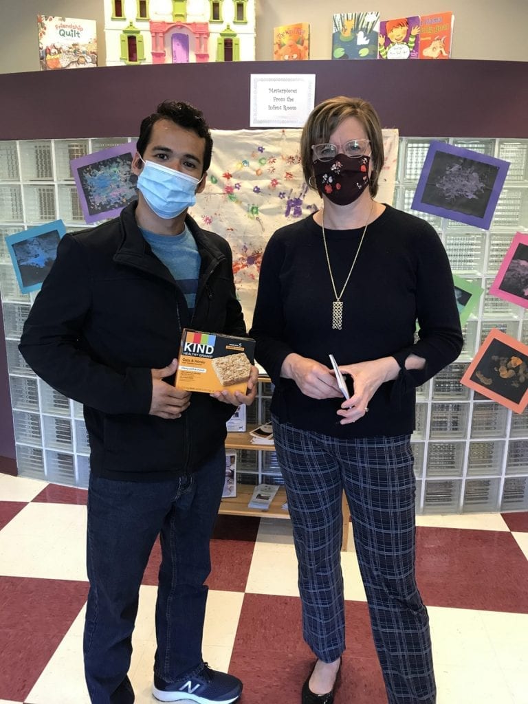 Victor Morales, a new nursing student, member of the The KIND club recently stopped by the Child Care Center at SUNY Broome and gave some of the children a Kind snack.
