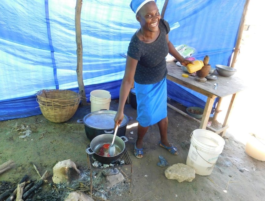 woman cooking in Haiti
