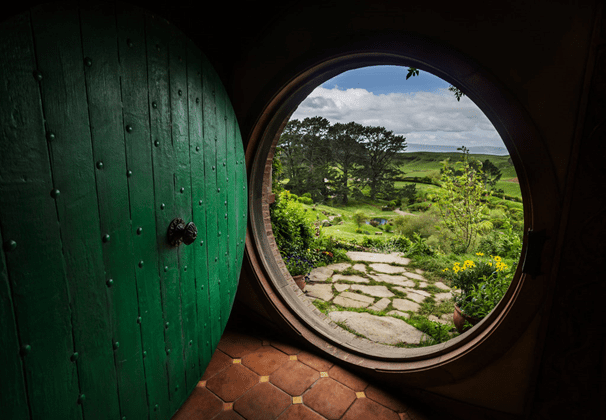 view out of a round window to the countryside