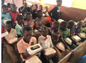 Haiti Children in Classroom at Holiday Party 2021 - students receiving gifts