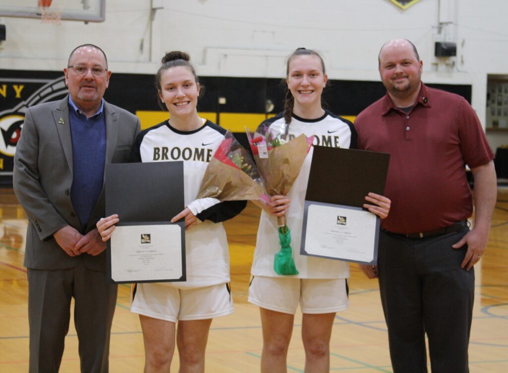 Megan Carden and Melissa Carden recognized for their efforts on the court prior to the start of the game