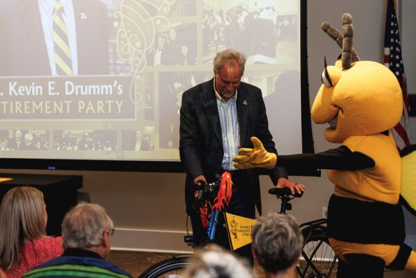 Dr Drumm Retirement Party - Receiving a new bike.