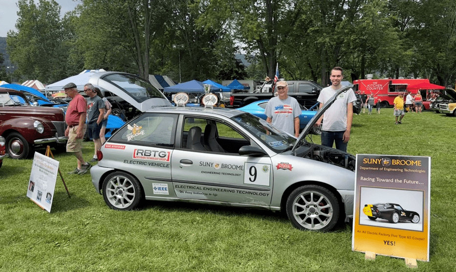 Gary DiGiacomo and EET Graduate, Michael DiGiacomo, with SUNY Broome’s award-winning electric vehicle at Spiedie Fest 2023.