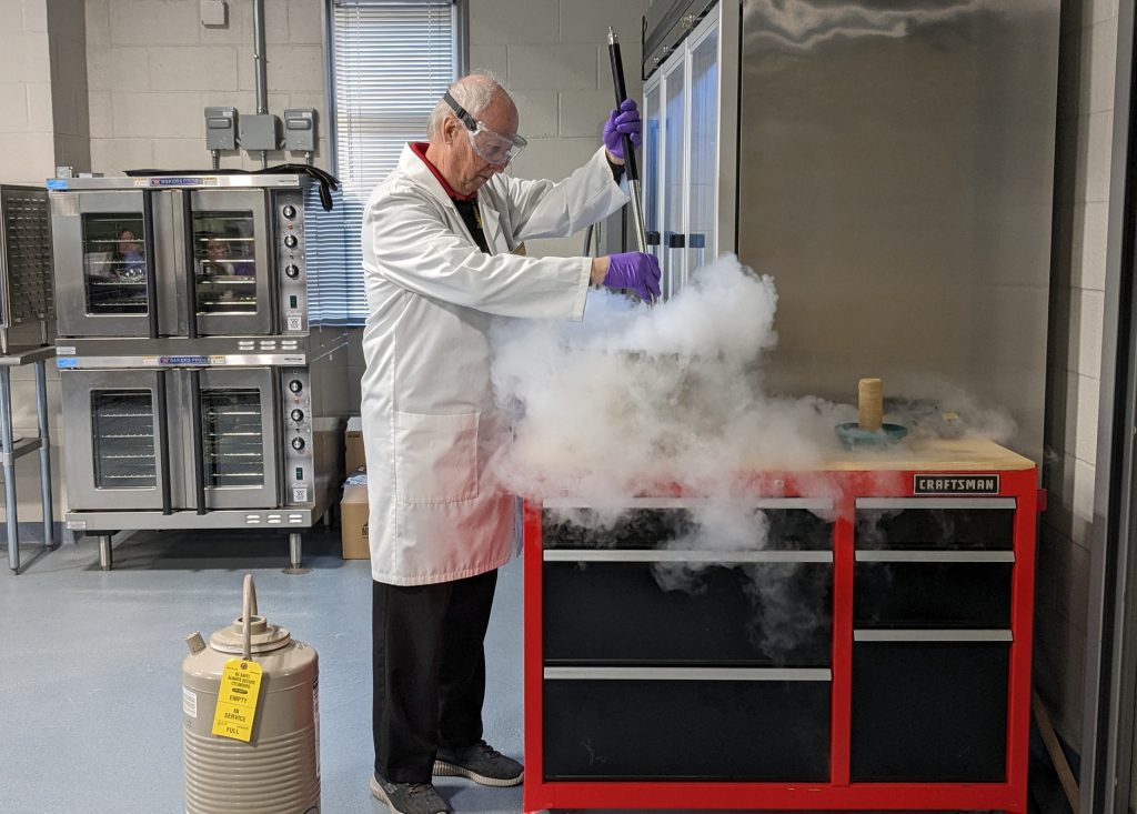 Chemistry Professor Dr. Harold Trimm shows off some food science wizardry during a demonstration.