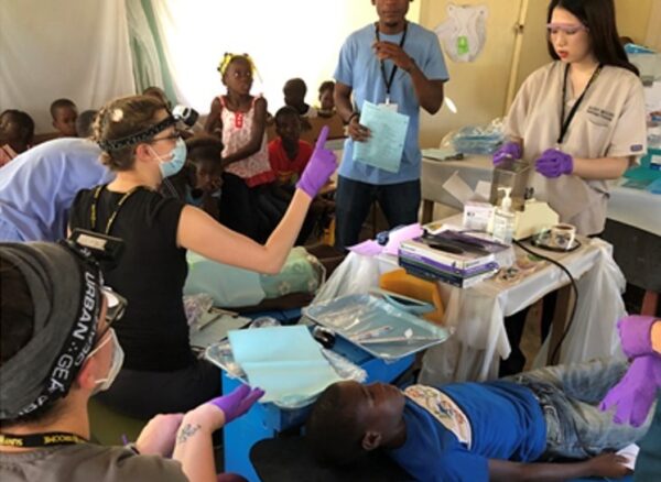 DH Students providing dental sealants on Haitian children in 2019.