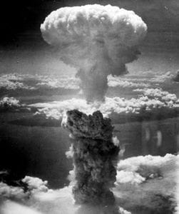 Mushroom cloud from the atomic explosion over Nagasaki rising 18,000 m (59,000 ft) into the air on the morning of August 9, 1945. Via Wikimedia Commons