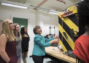 Professor Susan Schwing discusses the workings of Rube Goldberg devices with Engineering Science students at SUNY Broome