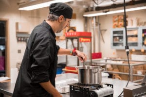 Allen Conti prepares for the Hospitality Club's weekly soup sale