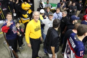 President Drumm (center) with participants in SUNY Broome Night at the Binghamton Devils game.